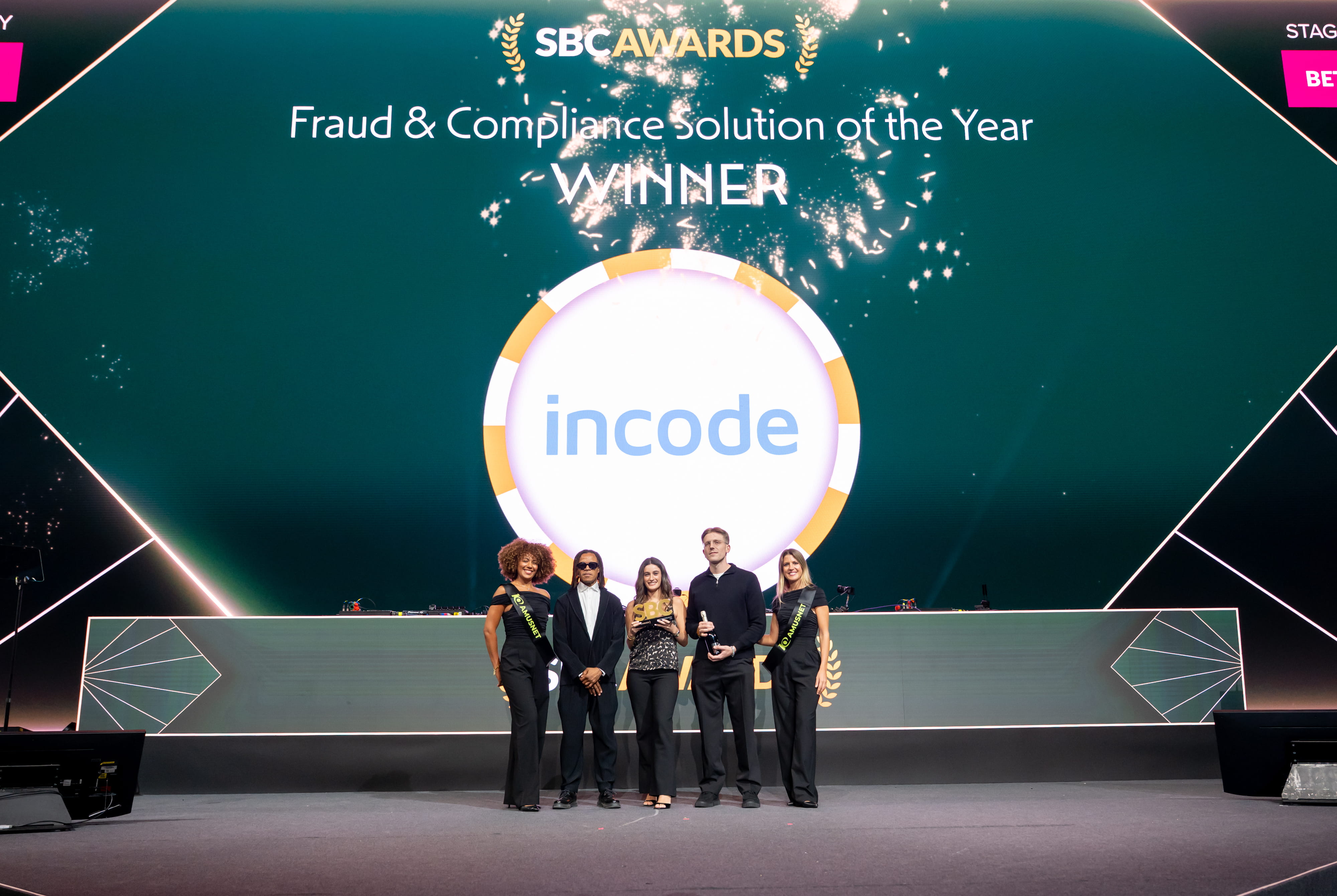 A photo of the Incode team posing in front of their win announcement.