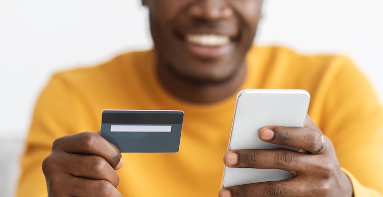man holding a phone using portable identity for financial services